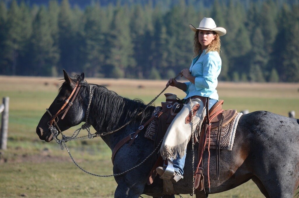 Author Kim Brackett on horseback