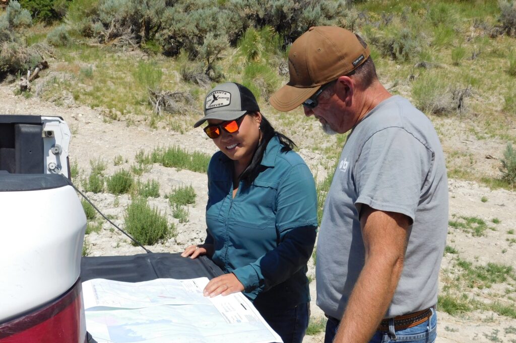 Kellie Dobrescu and Shane Boren meet-up in the field to review a conservation project’s progress.