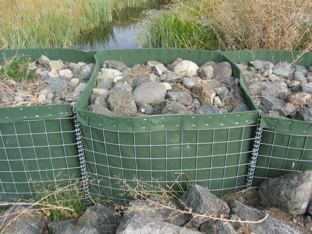 Green boxes filled with rocks.